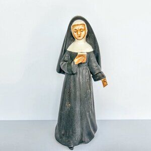 Ceramic Nun with a bible in hand. Sticker on bottom Ucagco ceramics Japan
